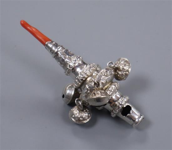 A Victorian silver childs rattle, with whistle, five bells and coral teether, Hilliard & Thomason, Birmingham, 1872 86mm.